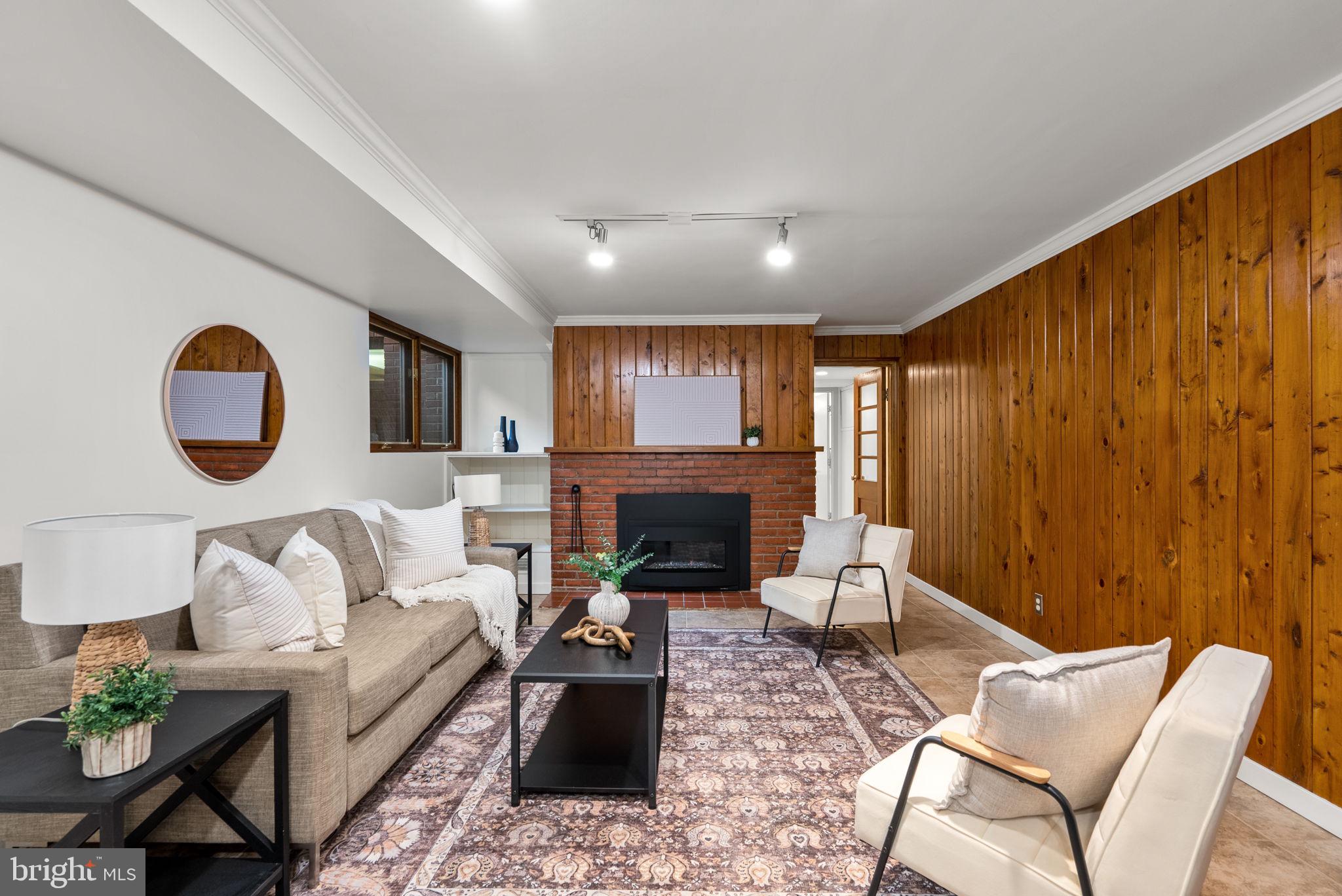 9109 Fairview Road Silver Spring, MD 20910 - Photo 32 of 46 a living room with furniture and a fireplace
