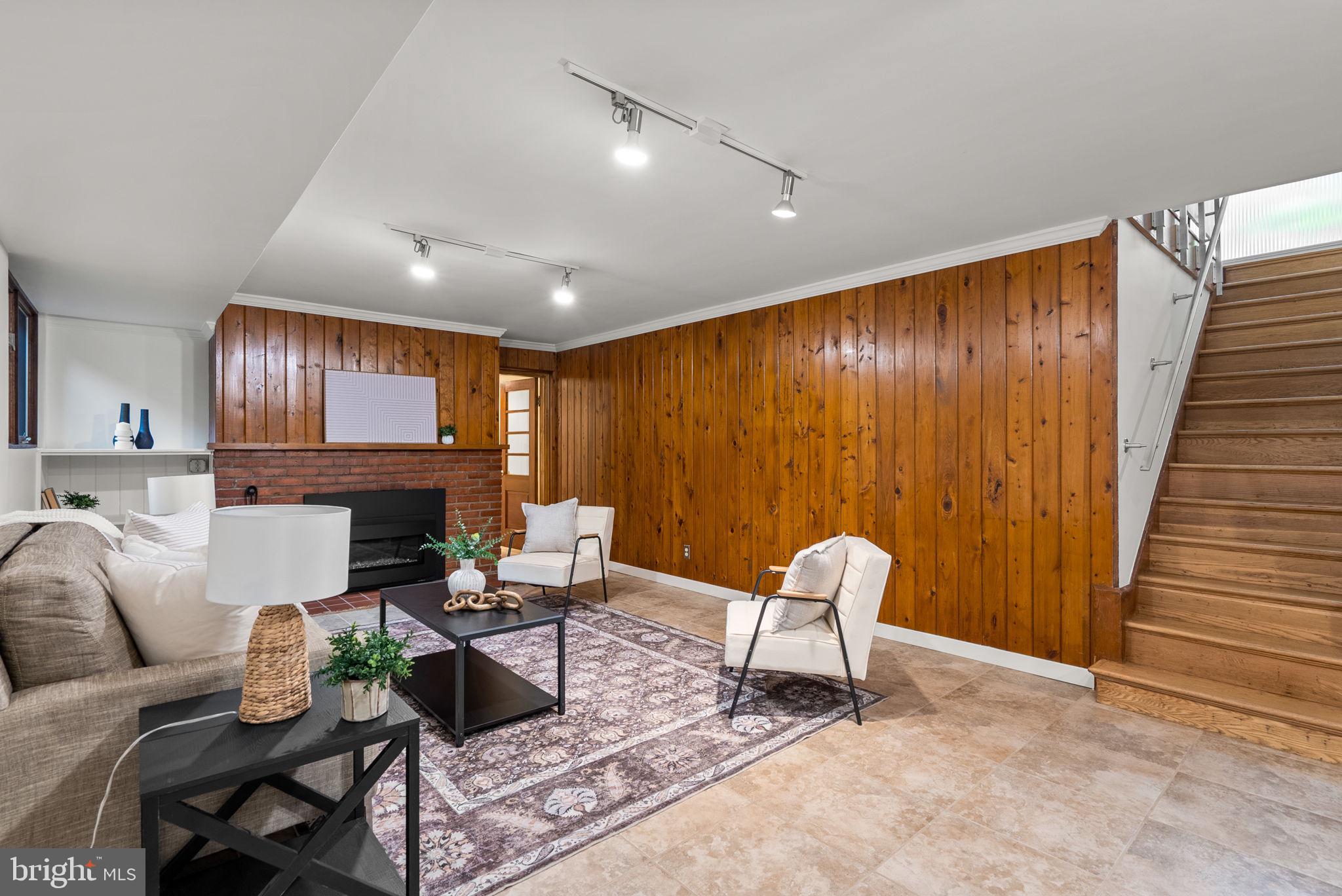 9109 Fairview Road Silver Spring, MD 20910 - Photo 33 of 46 a living room with furniture and a wooden floor