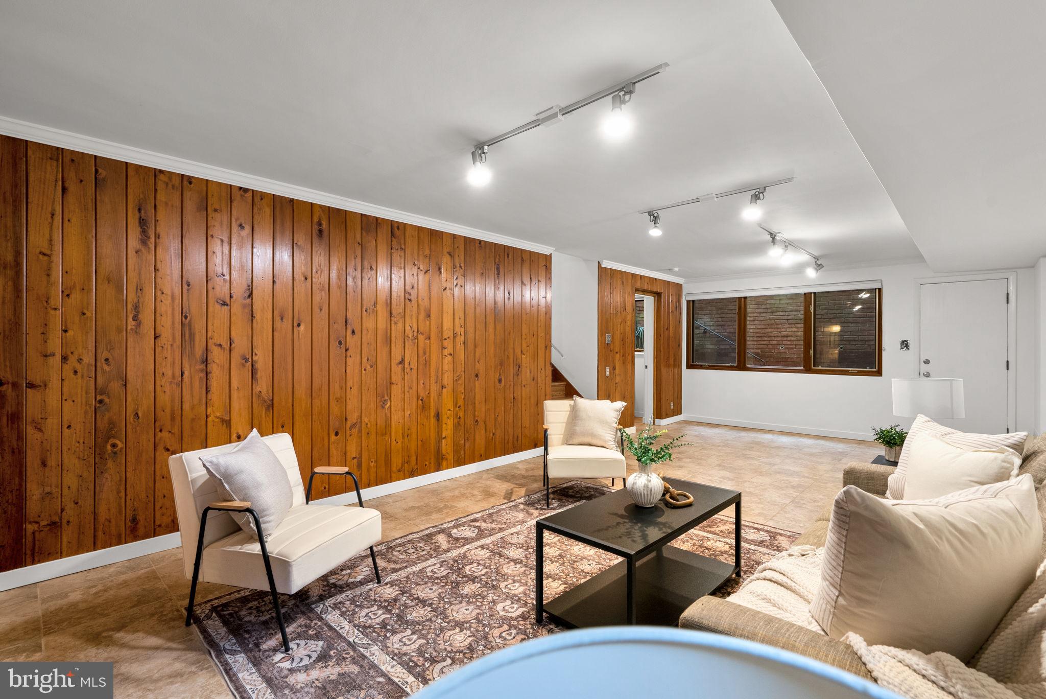 9109 Fairview Road Silver Spring, MD 20910 - Photo 34 of 46 a living room with furniture and a large window