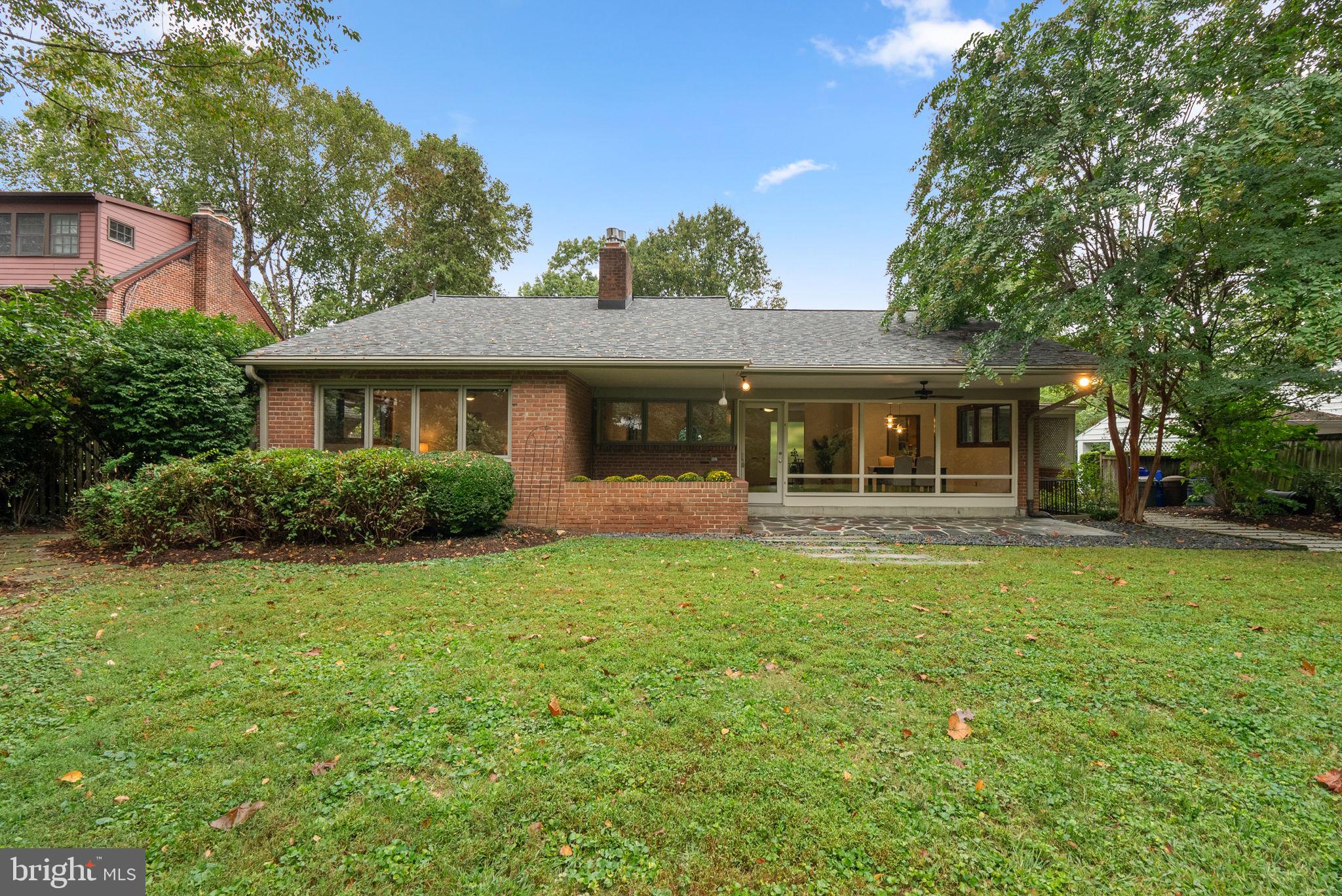 9109 Fairview Road Silver Spring, MD 20910 - Photo 40 of 46 a front view of a house with a garden