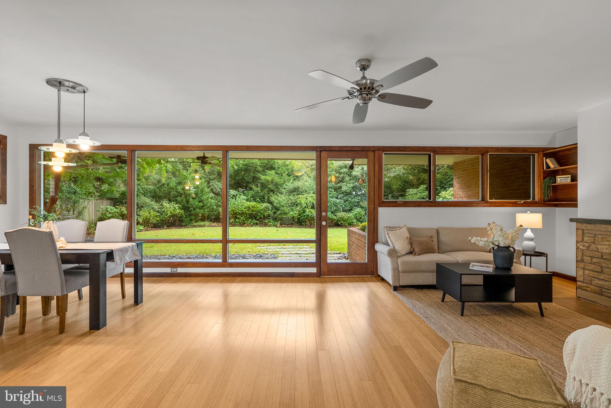 9109 Fairview Road Silver Spring, MD 20910 - Photo 4 of 46 a living room with furniture and a floor to ceiling window