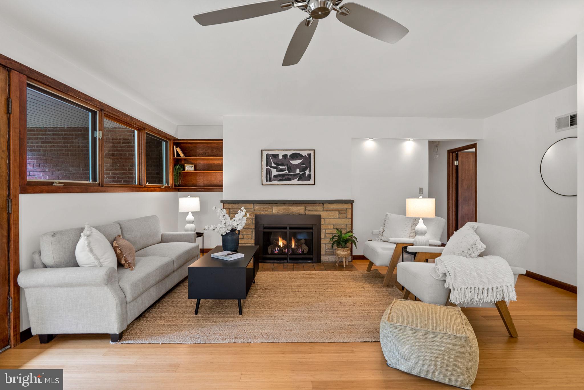 9109 Fairview Road Silver Spring, MD 20910 - Photo 6 of 46 a living room with furniture and a fireplace