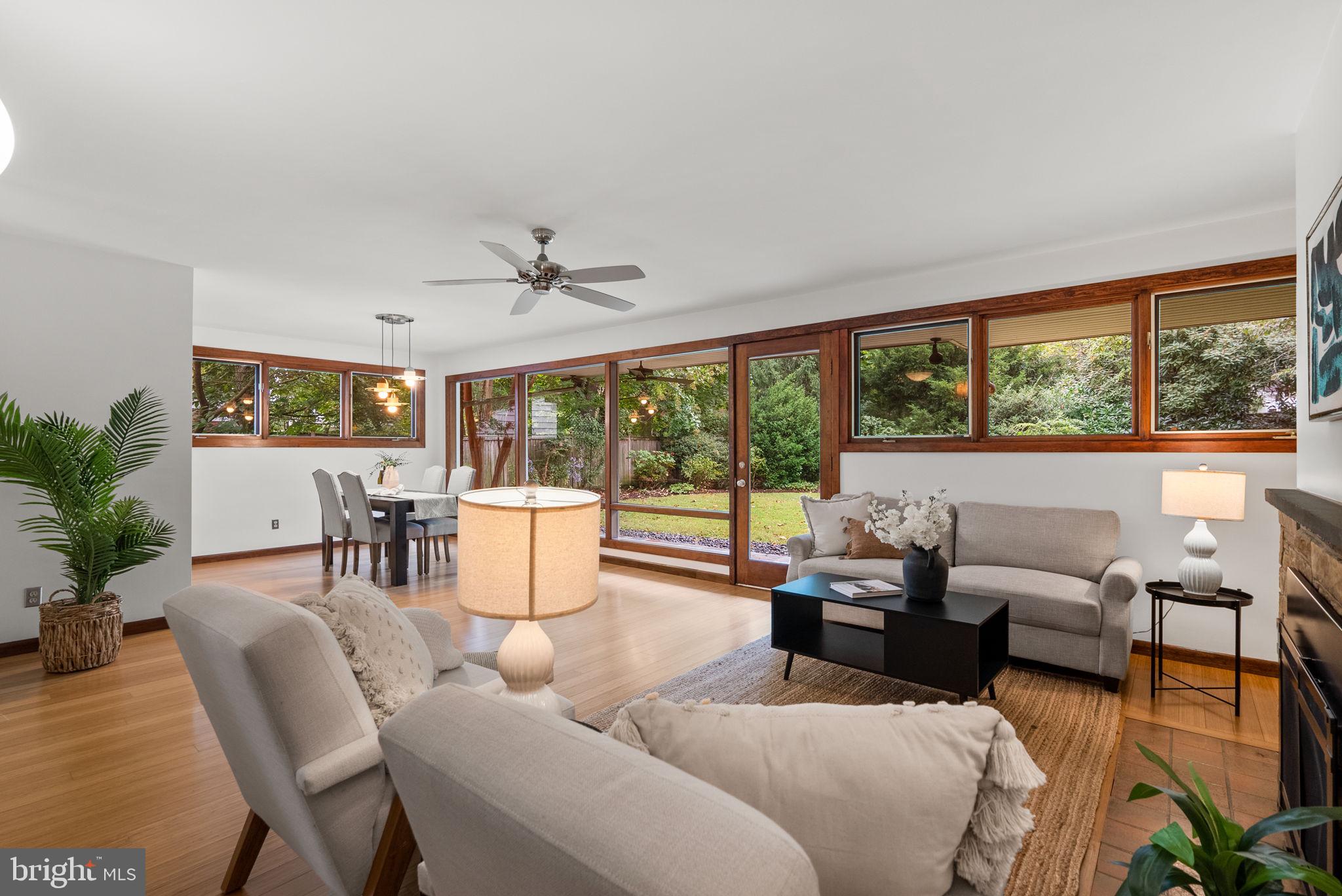 9109 Fairview Road Silver Spring, MD 20910 - Photo 9 of 46 a living room with furniture and a large window