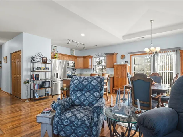 a living room with fireplace furniture and a wooden floor