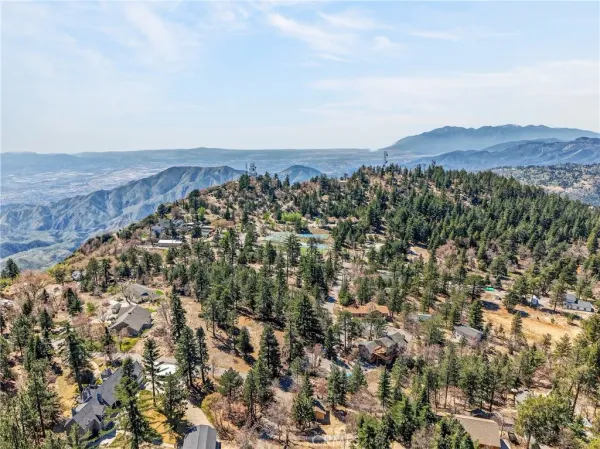 an aerial view of residential house and mountain view