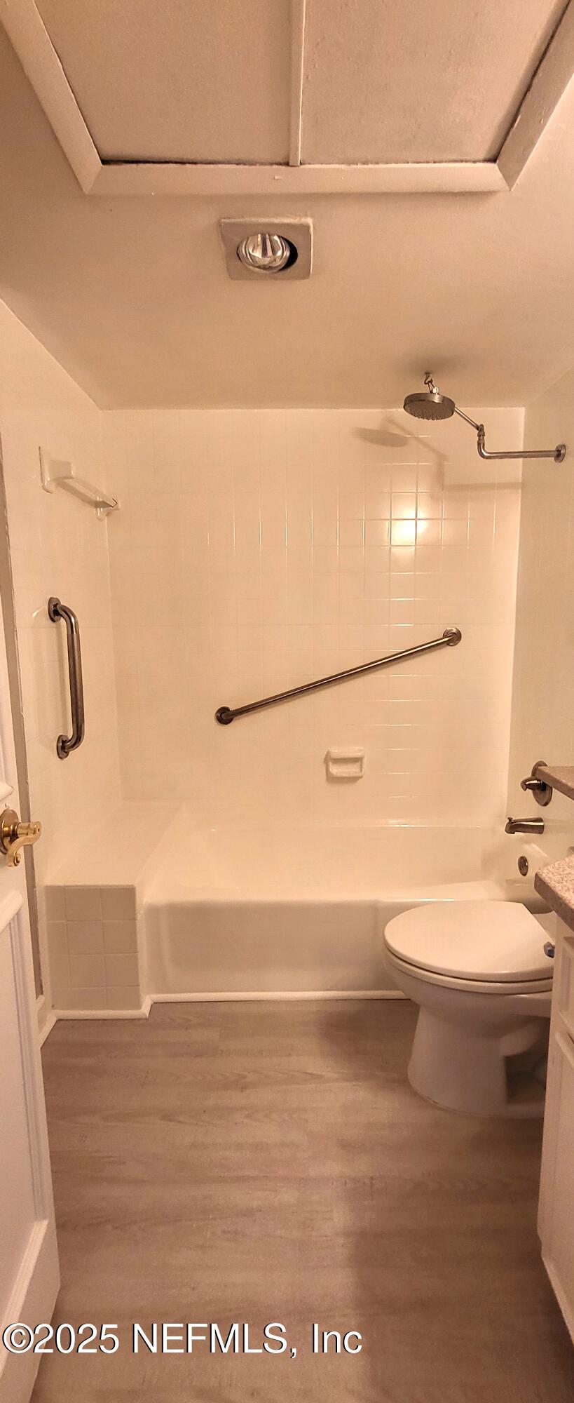 600 Domenico Circle, Unit A12 St. Augustine, FL 32086 - Photo 10 of 11 a bathroom with a white toilet and a shower