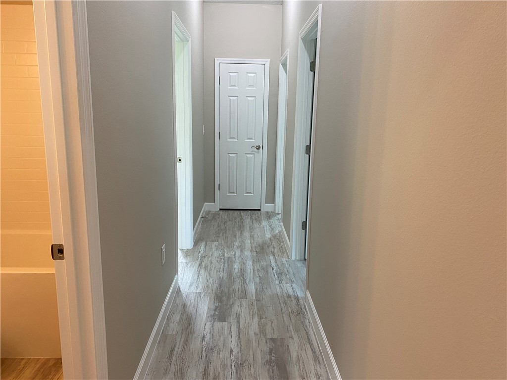 109 Aetna Street, Unit B Sebastian, FL 32958 - Photo 13 of 26 a view of a hallway with wooden floor