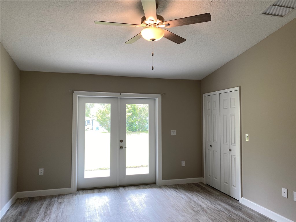 109 Aetna Street, Unit B Sebastian, FL 32958 - Photo 18 of 26 wooden floor in an empty room with a window