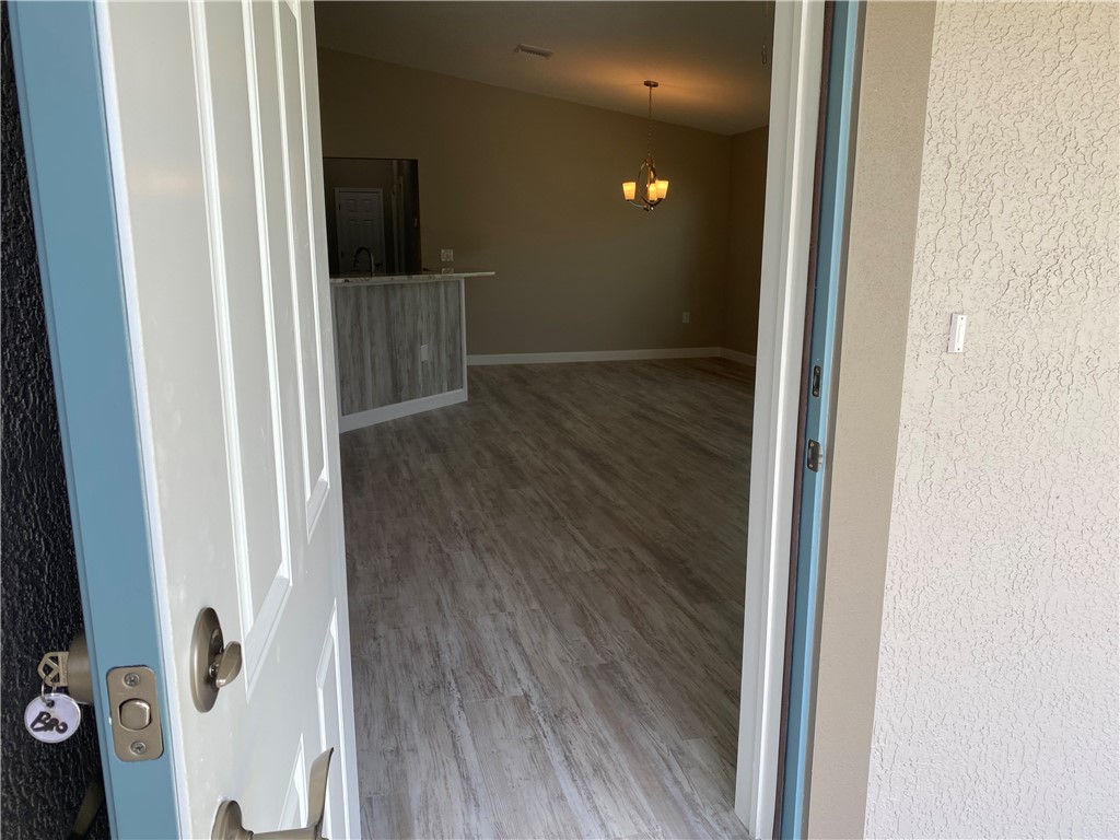 109 Aetna Street, Unit B Sebastian, FL 32958 - Photo 3 of 26 view of hallway with wooden floor
