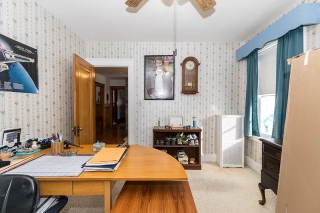 a bedroom with a bed and a table in it