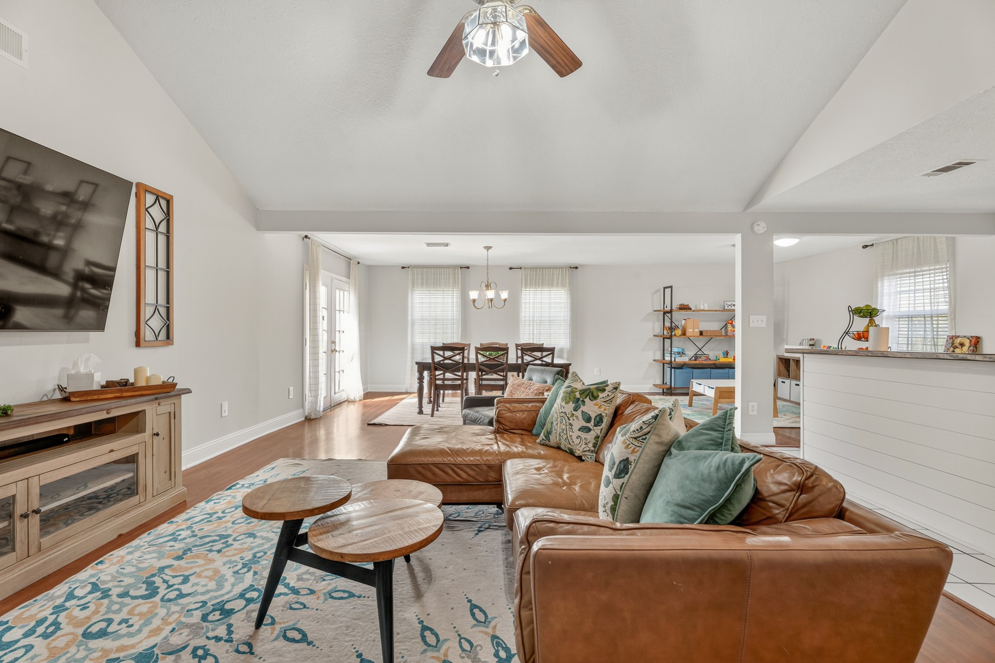 2104 Rose Road Pearland, TX 77581 - Photo 10 of 43 a living room with furniture and a flat screen tv