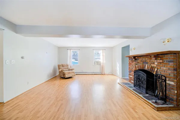 a view of an empty room with fire place