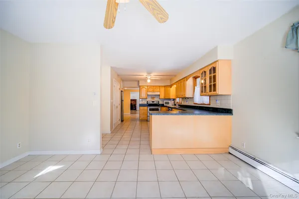 a view of a kitchen with a sink and dishwasher a refrigerator freezer