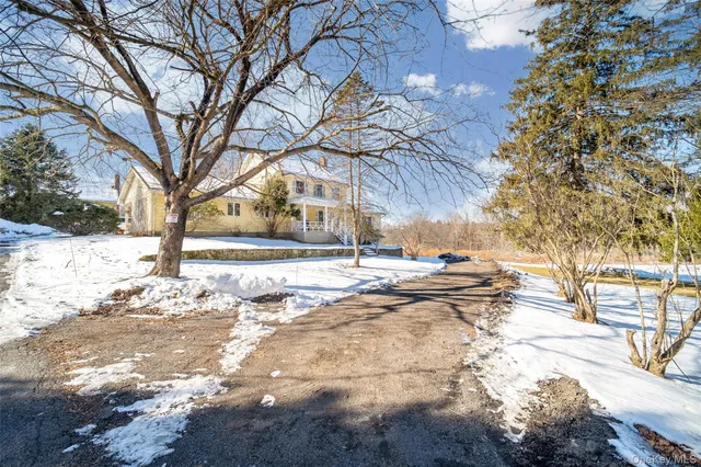 a view of snow on the side of a road