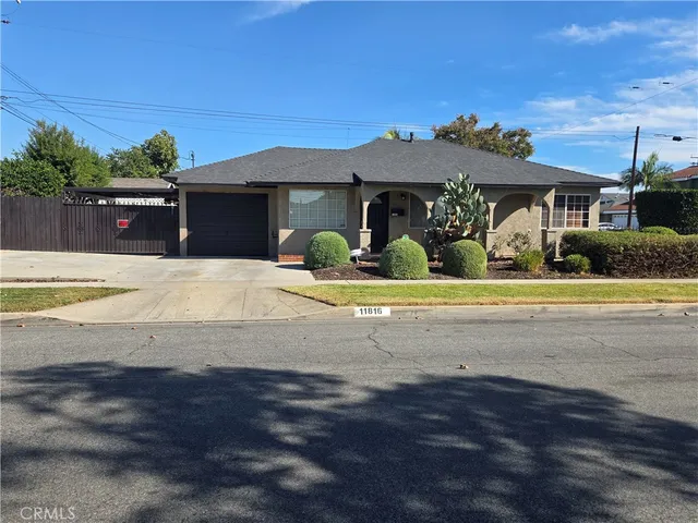 a view of house with yard and entertaining space