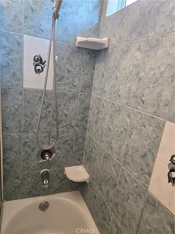 a bathroom with a sink and a shower