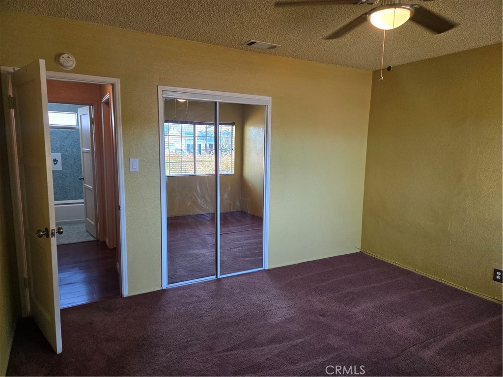 11816 Arlee Avenue Norwalk, CA 90650 - Photo 7 of 30 an empty room that has a mirror