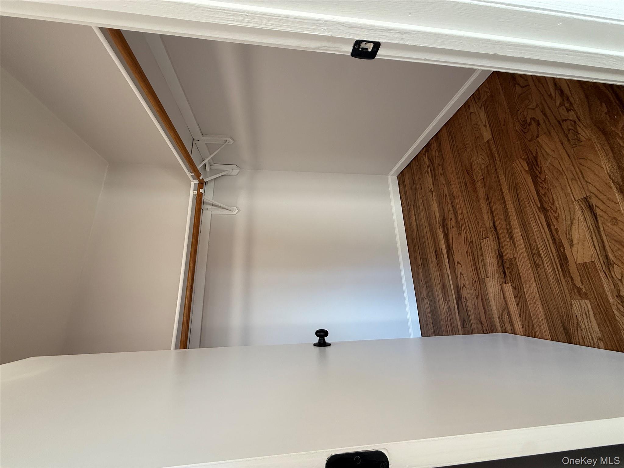 130-09 58th Road Queens, NY 11355 - Photo 17 of 18 Spacious closet with dark wood-type flooring