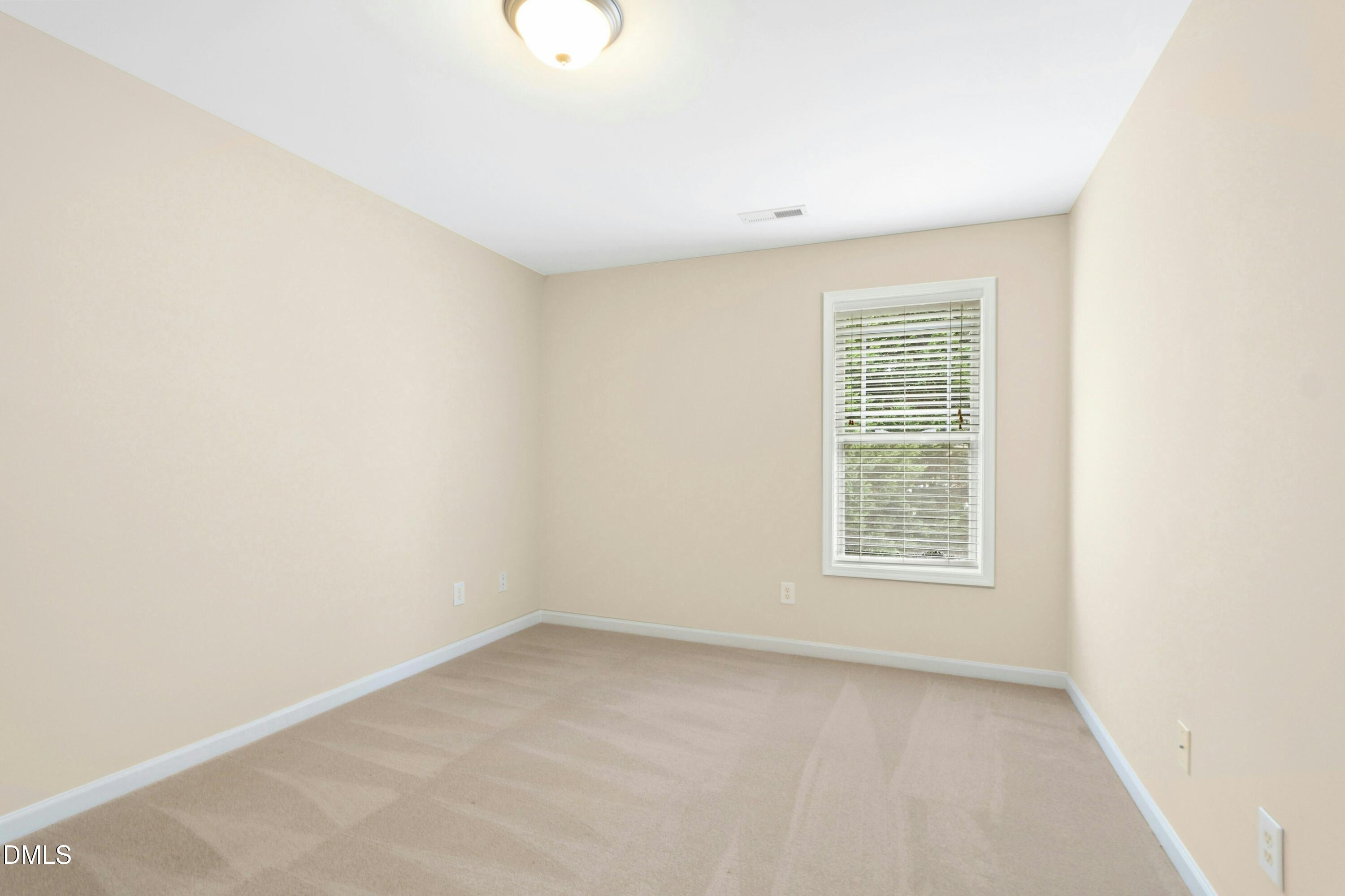 5541 Nur Lane Raleigh, NC 27606 - Photo 28 of 33 an empty room with a window
