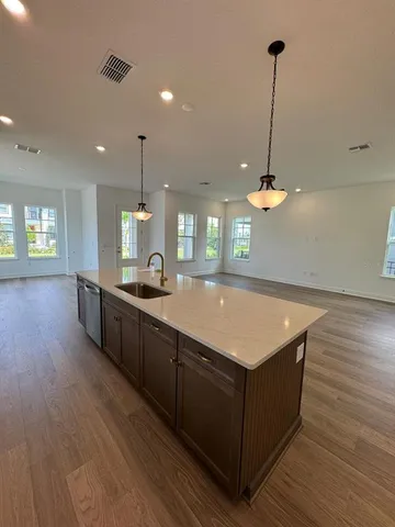 a room with pool table and wooden floor