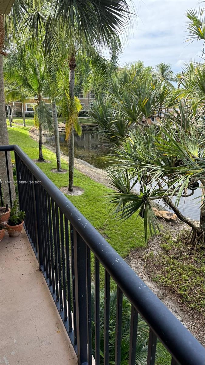 8871 Wiles Road, Unit 208 Coral Springs, FL 33067 - Photo 14 of 15 a view of a garden from a balcony