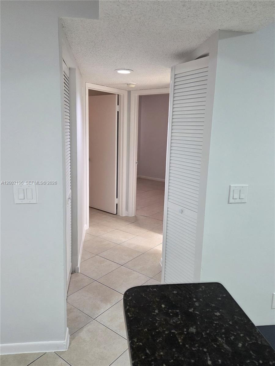 8871 Wiles Road, Unit 208 Coral Springs, FL 33067 - Photo 5 of 15 a view of a closet area