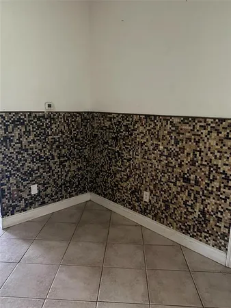 a kitchen with cabinets appliances and a sink