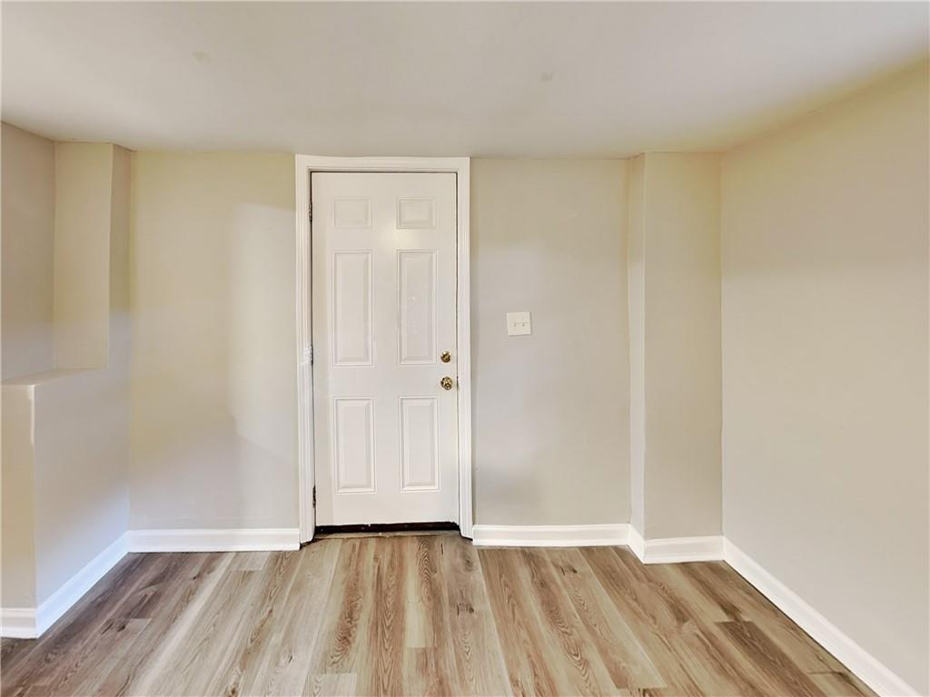 2875 3rd Avenue Southwest, Unit B Atlanta, GA 30315 - Photo 4 of 20 a view of an empty room and wooden floor