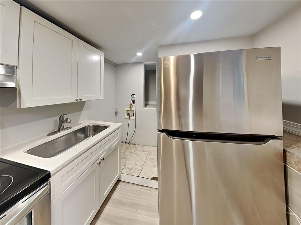 2875 3rd Avenue Southwest, Unit B Atlanta, GA 30315 - Photo 7 of 20 a view of a kitchen with a sink and dishwasher