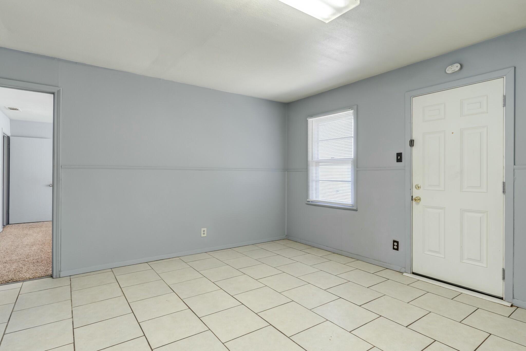 3013 45th Street Lubbock, TX 79413 - Photo 17 of 30 a view of an empty room and window