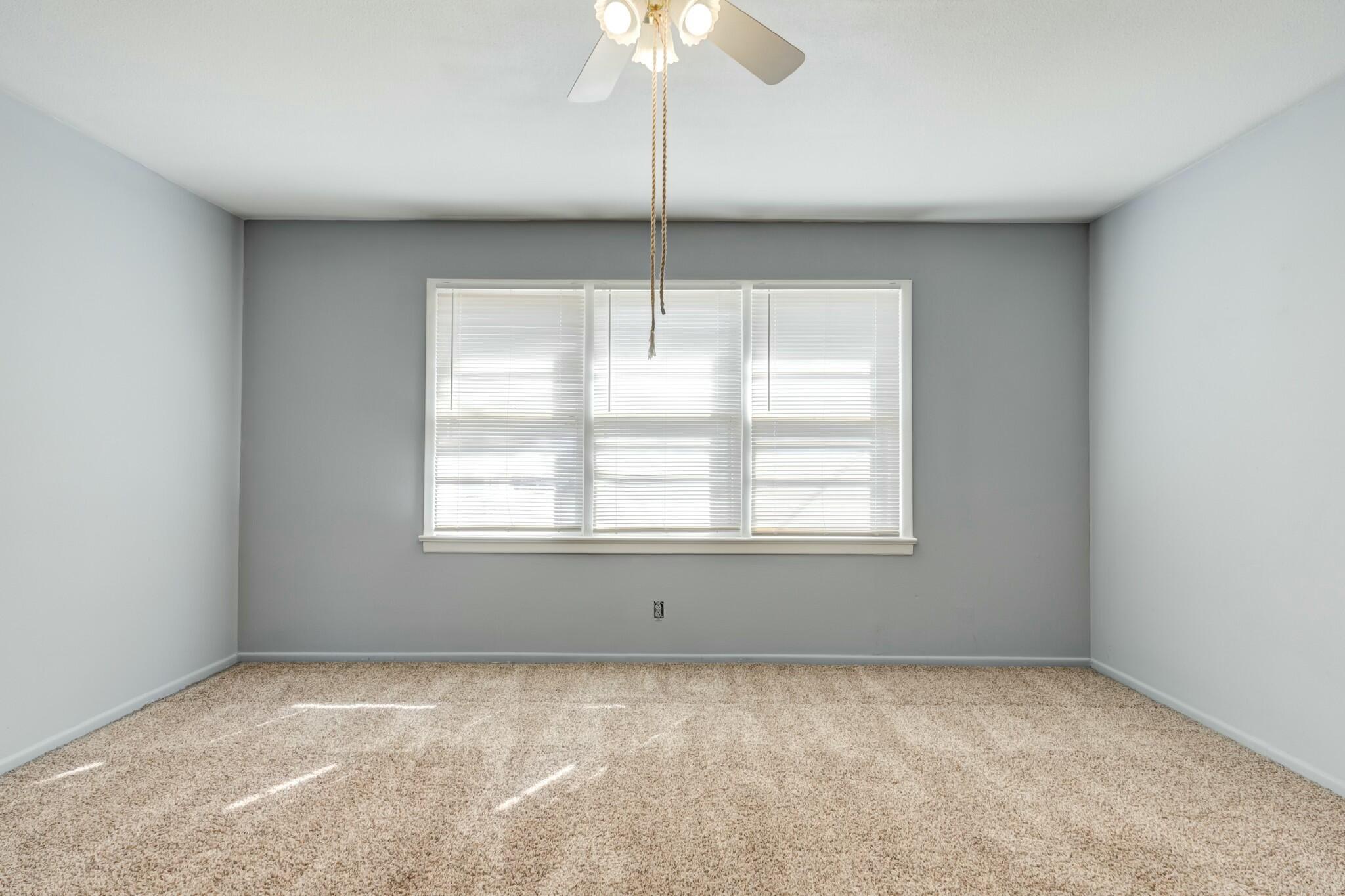 3013 45th Street Lubbock, TX 79413 - Photo 19 of 30 a view of an empty room with a window