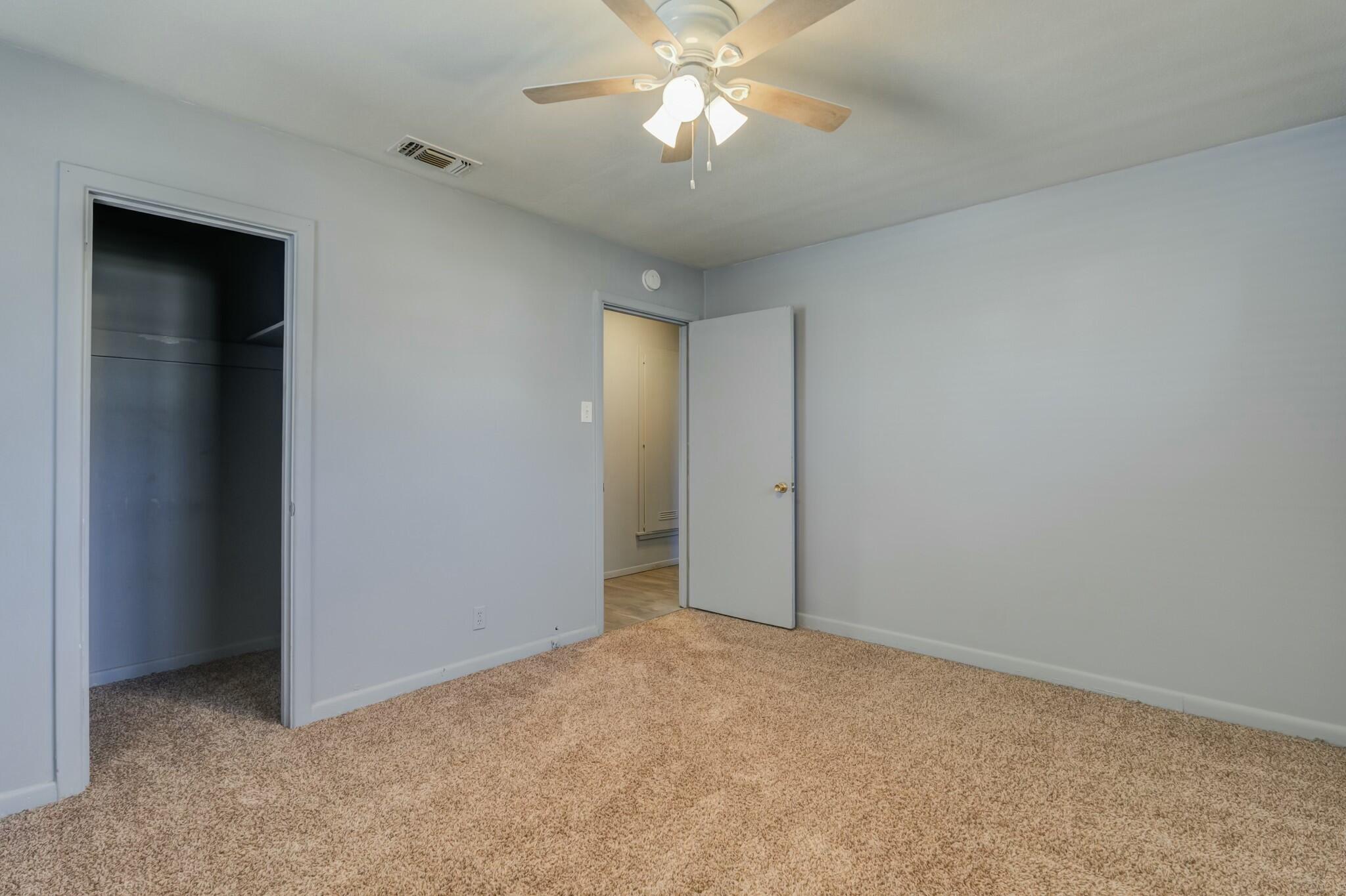 3013 45th Street Lubbock, TX 79413 - Photo 24 of 30 a view of an empty room and chandelier fan