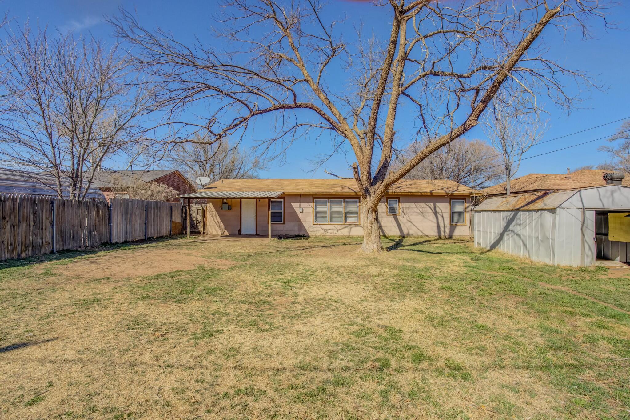 3013 45th Street Lubbock, TX 79413 - Photo 30 of 30 a house view with a trees in front of it