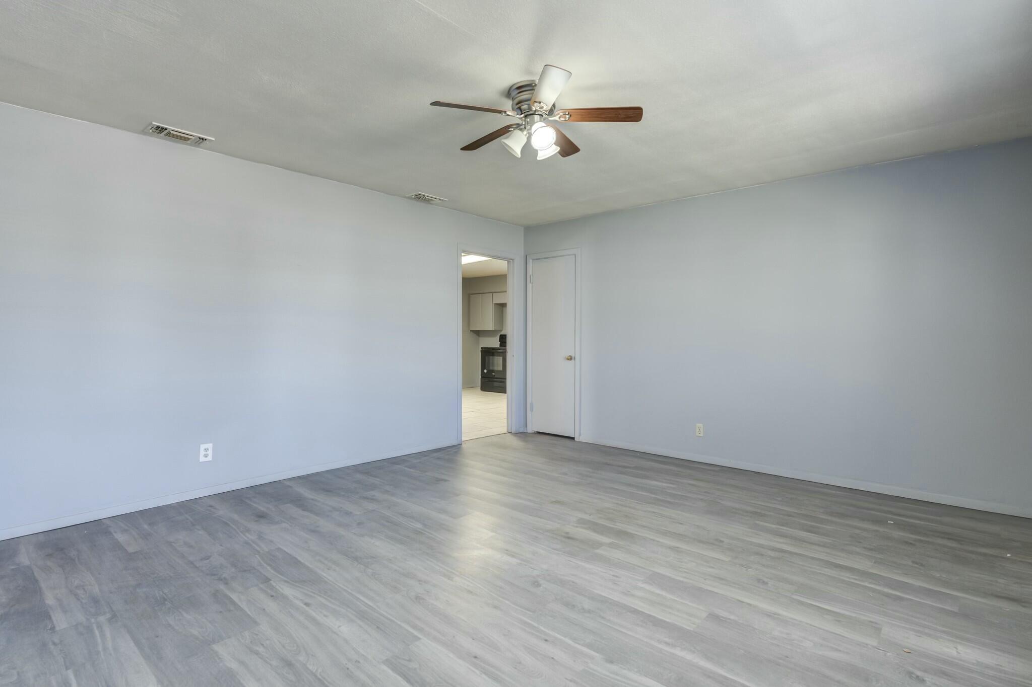 3013 45th Street Lubbock, TX 79413 - Photo 9 of 30 wooden floor in an empty room