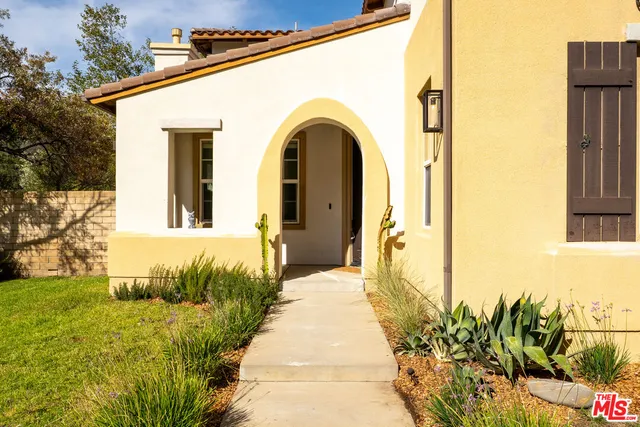 a kitchen with a stove a sink and a refrigerator