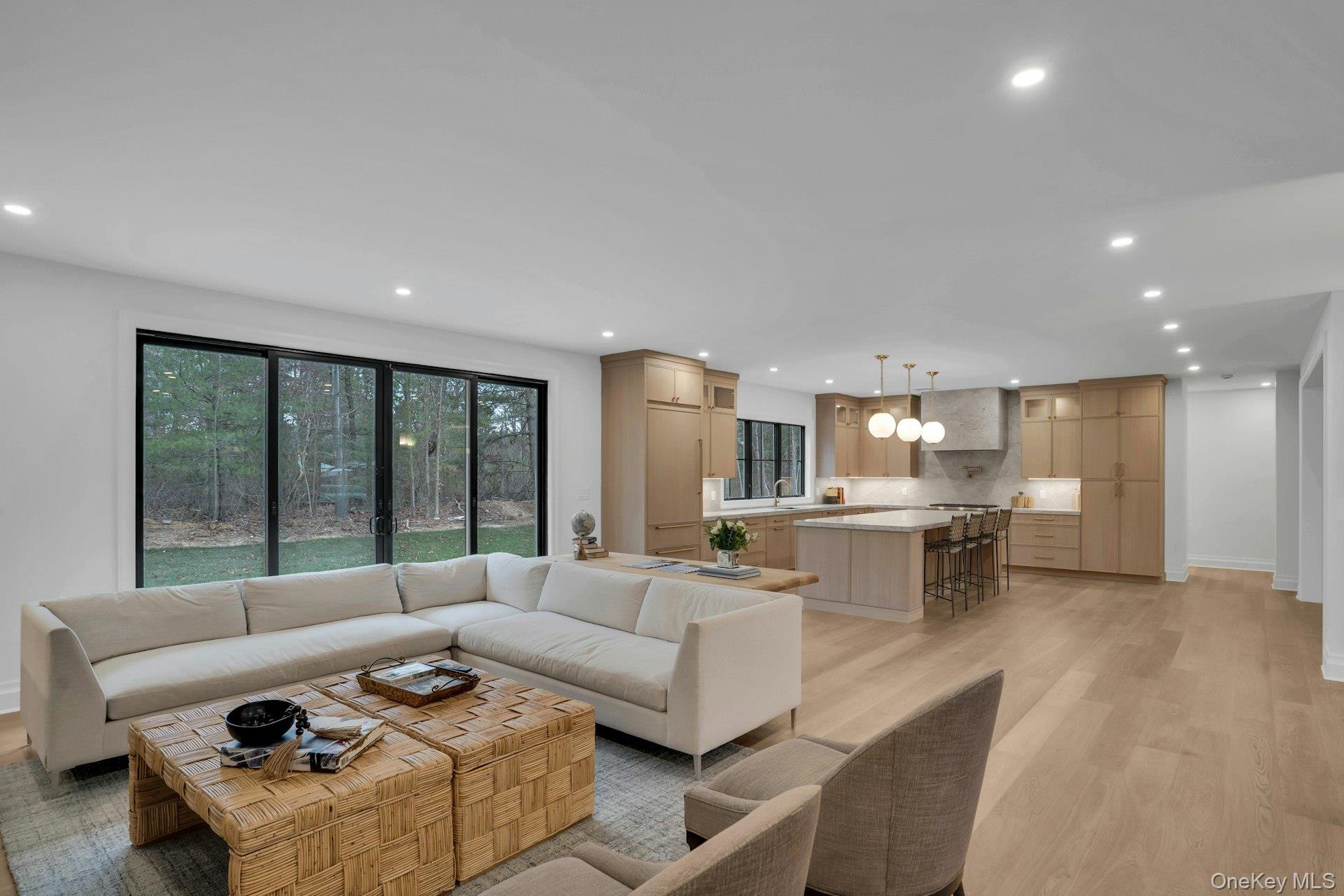 Lot 1-1003 Baldwin Path Dix Hills, NY 11746 - Photo 15 of 50 a living room with furniture and a large window