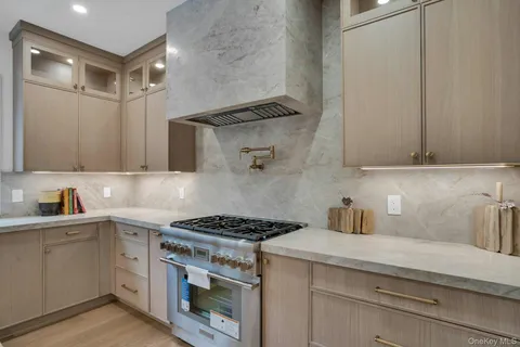 a kitchen with a stove and a sink