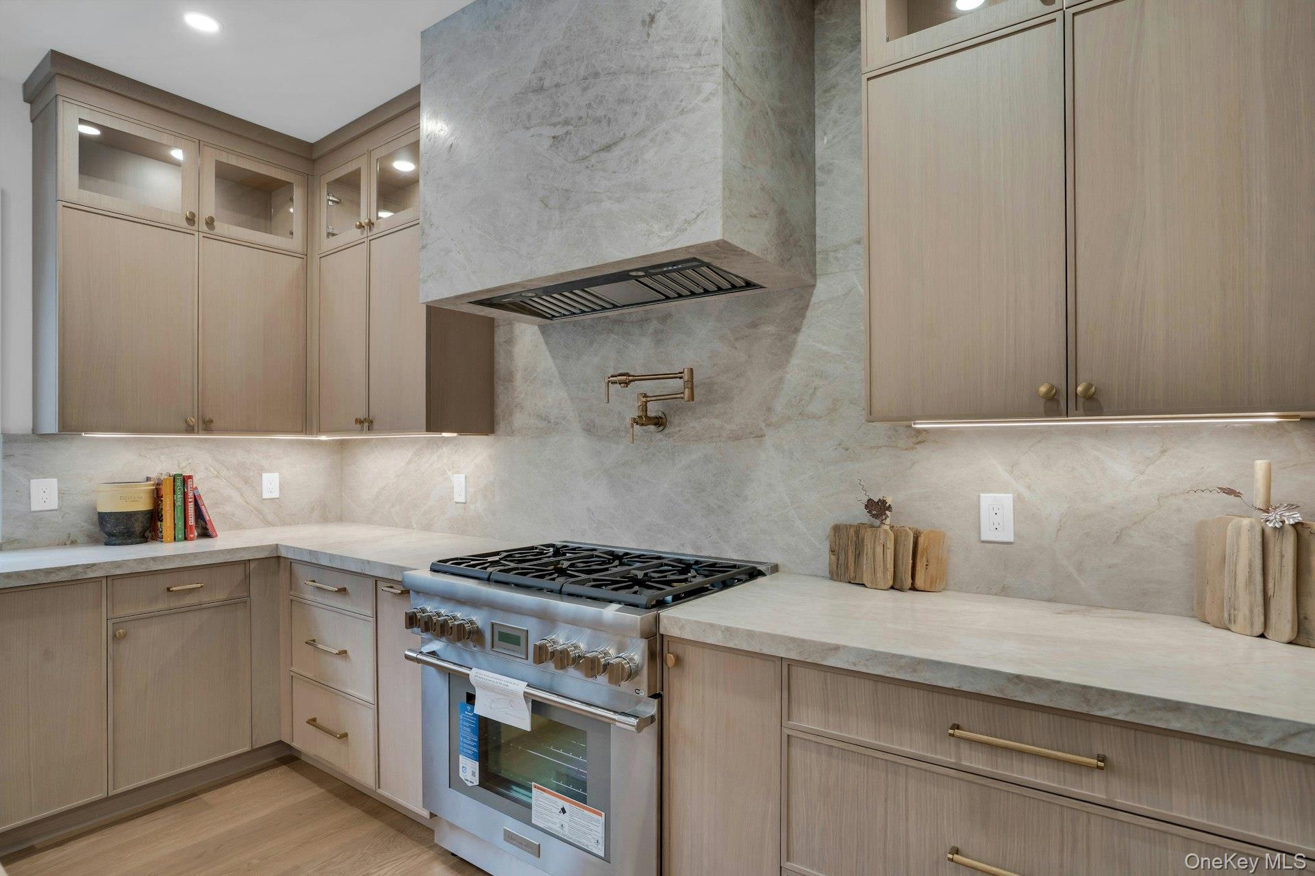 Lot 1-1003 Baldwin Path Dix Hills, NY 11746 - Photo 23 of 50 a kitchen with stainless steel appliances a stove and cabinets