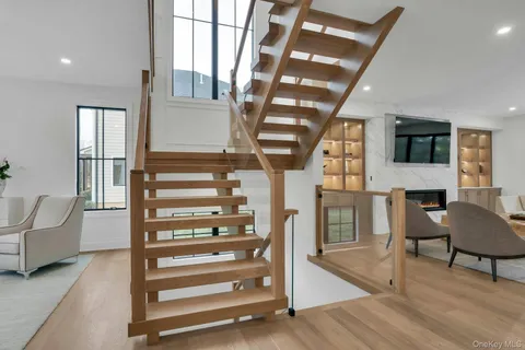 a view of entryway and hall with wooden floor
