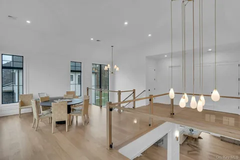 a dining room with furniture and wooden floor