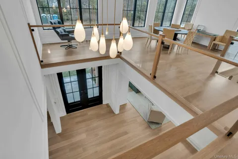 a view of a living room with furniture and a table