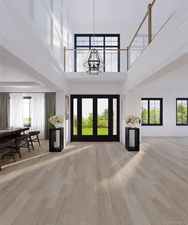 a view of an empty room with furniture and a fireplace