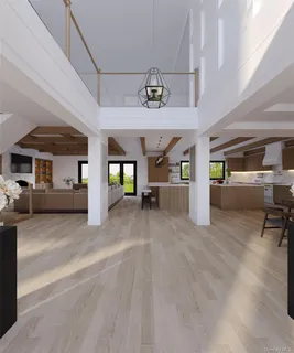 a view of a livingroom with hardwood and furniture