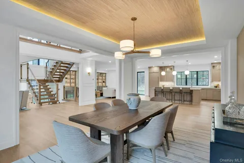 a large kitchen with a table and chairs