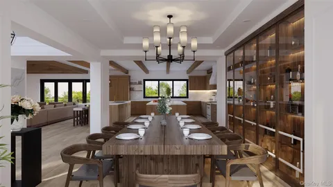 a view of a dining room with furniture a chandelier and wooden floor