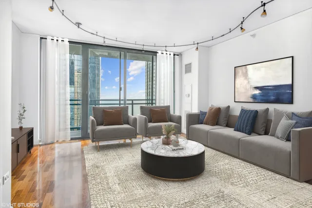a dining room with furniture window and wooden floor