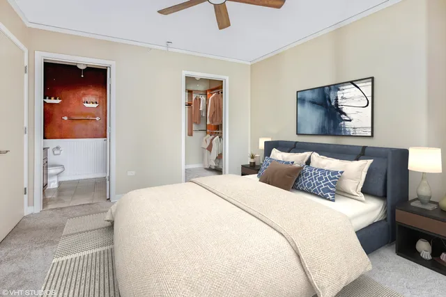 a bedroom with a large bed and a large window