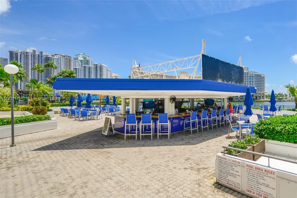 a area with lots of table and chairs