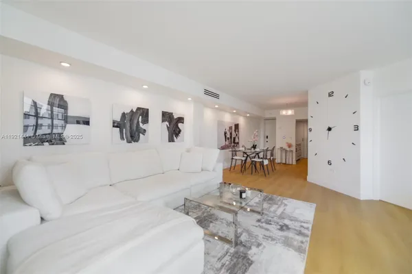a living room with furniture and a table