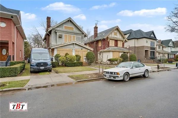 a car parked in front of a house